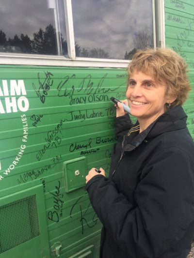 Tracy Olson signing bus